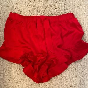 Red Victoria’s Secret shorts.